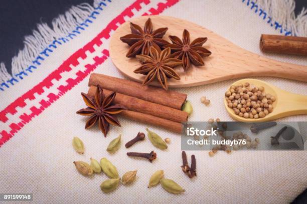 Assortment Spice Star Anise Cinnamon Sticks Cardamon Cloves And Coriander Seed Stock Photo - Download Image Now