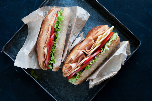 turkey and cheese sandwich baget sandwich including turkey chese tomatoes and lettuce Subway Sandwich stock pictures, royalty-free photos & images