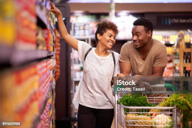 Shopping Together For All Their Essentials Stock Photo - Download Image Now - Supermarket, Shopping, Retail