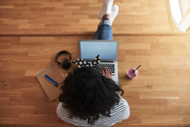 istock African female university student working online on a campus floor 891624544
