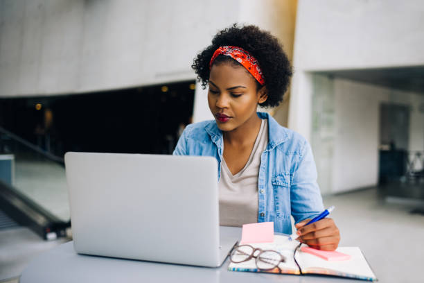 istock Focused young African entrepreneur hard at work on a laptop 891627874