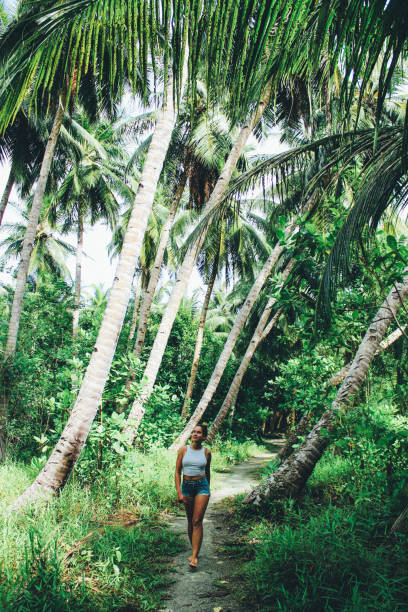 istock Woman walking through jungle 891634198