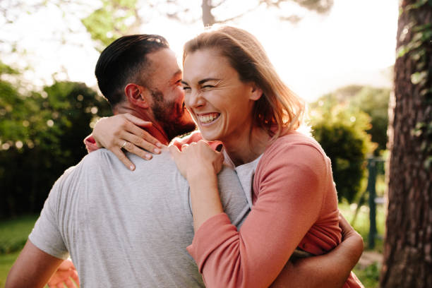 istock Happy couple having fun outdoors in park 891634462