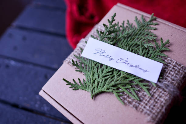 istock Decorated Christmas Holiday Present in the Cardboard Box 891634486