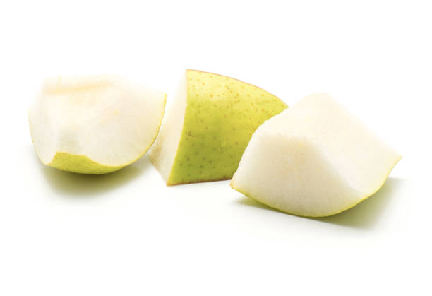 Green pear isolated Three green pear sliced pieces isolated on white background"n bartlett williams pears stock pictures, royalty-free photos & images