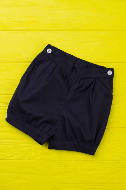 istock Navy shorts on yellow shelf 891635346