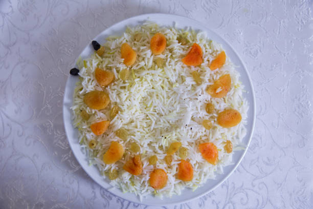 Hot rice on a plate . Sultana , dried apricots