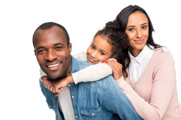 happy african american family happy african american family hugging and smiling at camera isolated on white the black womens expo stock pictures, royalty-free photos & images