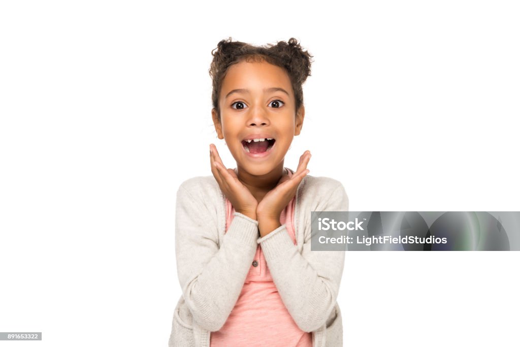 surprised african american child beautiful surprised african american child smiling at camera isolated on white Child Stock Photo