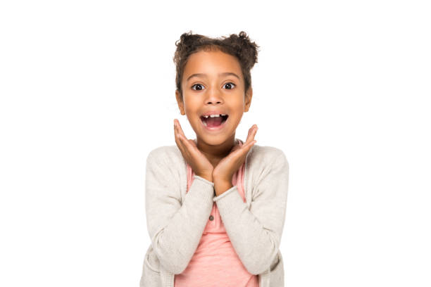 surprised african american child beautiful surprised african american child smiling at camera isolated on white one girl only stock pictures, royalty-free photos & images