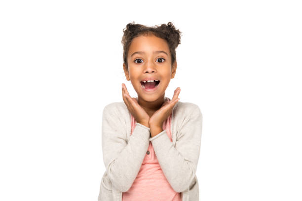 surprised african american child beautiful surprised african american child smiling at camera isolated on white smiling kids on white stock pictures, royalty-free photos & images