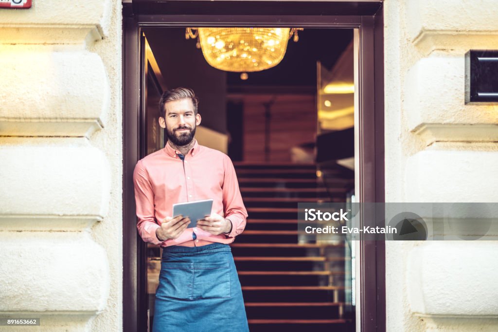 Barista is working in a coffee shop Small Business Stock Photo