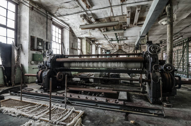 istock weaving machine in abandoned factory 891656304
