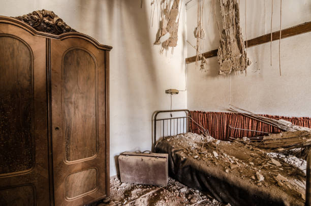 istock box and bed in an abandoned room 891656608