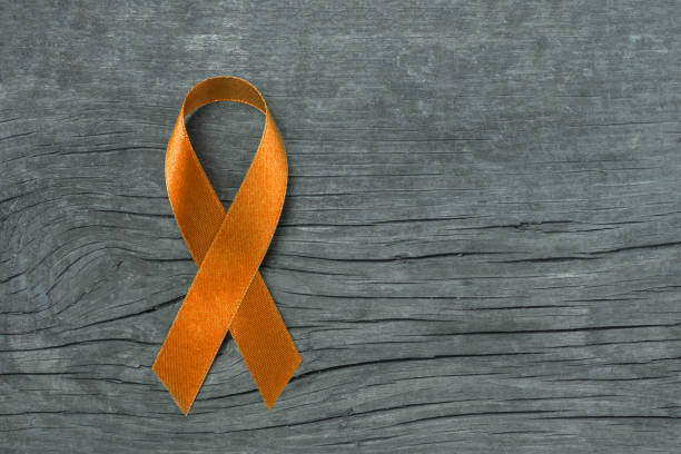 istock Orange ribbon for raising awareness on Leukemia, Kidney cancer RDS multiple sclerosis, ADHD illness 891662734