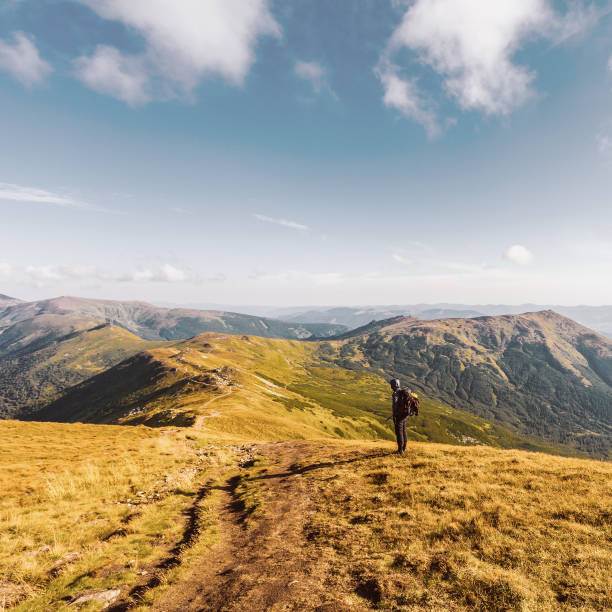 istock Traveler with backpack and mountain panorama 891676264