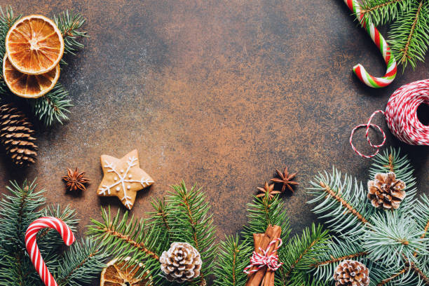 istock Traditional Christmas background with fir tree branch, cones and sweets 891694674