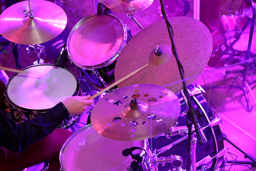 Drummer plays drums during party or wedding celebration