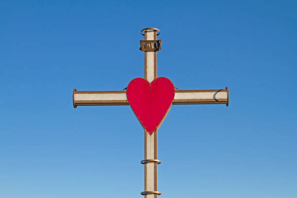 On a hill near Alcenago, high above the industrial town of Stallavena, stands this luminous cross with its striking red heart