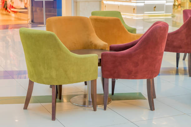 istock multicolored velvet armchairs around table in lounge zone 891698390