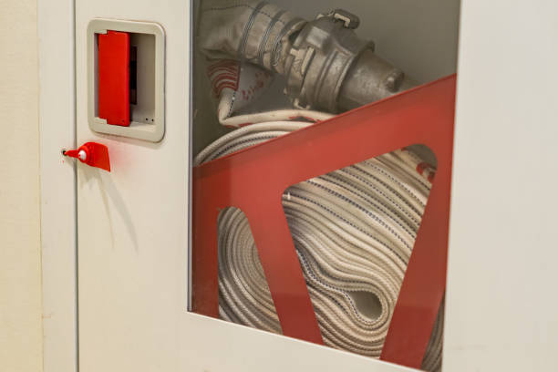 istock ydrant with water hoses and fire extinguish equipment on the wall 891698502