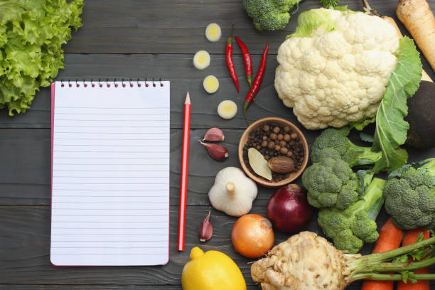 istock Fresh vegetables on dark wooden background. Mockup for menu or recipe. Top view with copy space 891699248