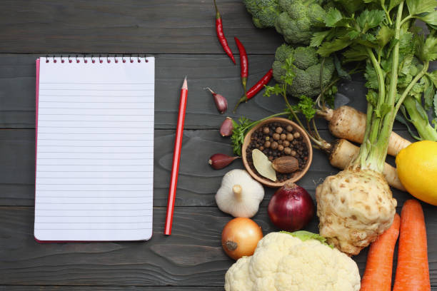 istock Fresh vegetables on dark wooden background. Mockup for menu or recipe. Top view with copy space 891699292