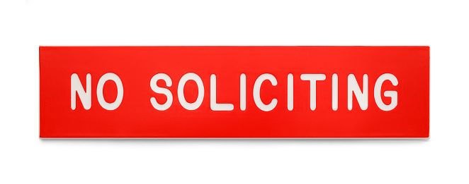 Red Plastic Rectangle No Soliciting Sign Isolated on White Background.