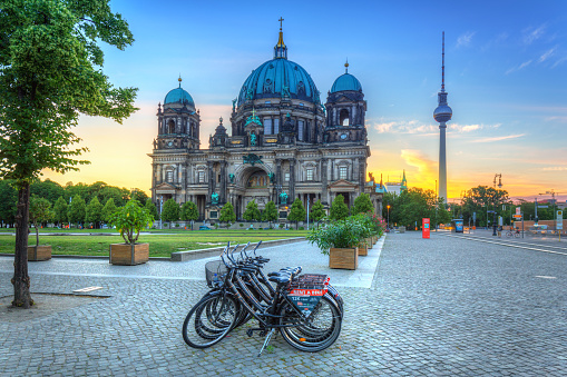 BERLIN, GERMANY - JUNE 15, 2017: Berlin Cathedral (Berliner Dom) and TV Tower at sunrise, Germany. Berlin is the capital and the largest city of Germany.