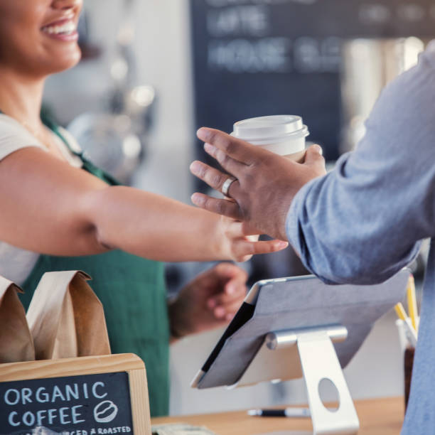 istock Barista hands male customer his coffee order 891713456
