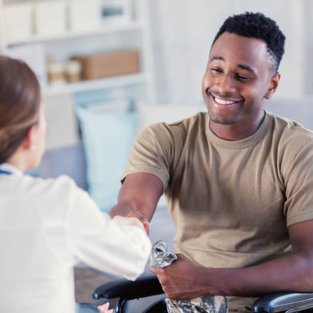 istock Military veteran shakes hands with therapist 891716764