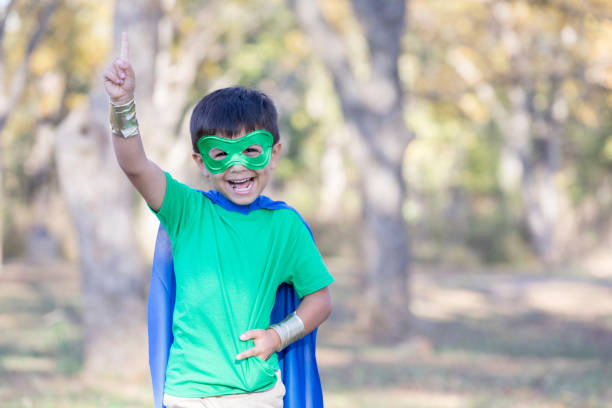 istock Happy little boy pretends to be superhero 891724342
