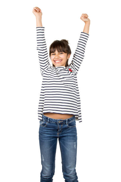 istock Isolated victorious little girl raising arms 891729442