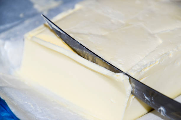 istock Cutting a butter knife. Butter and knife 891739122