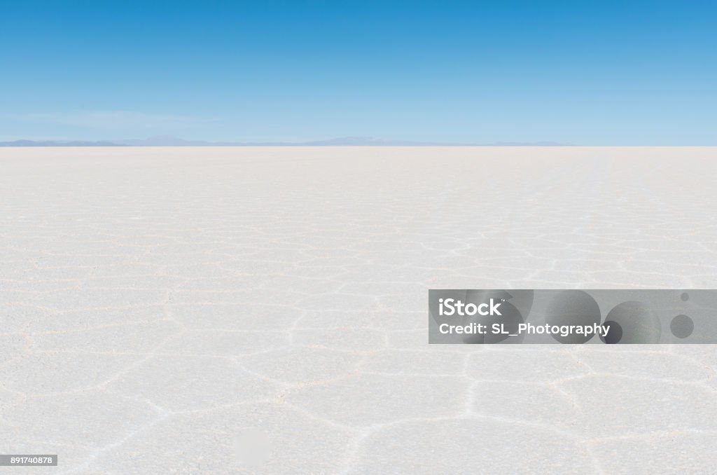 Infinity in Bolivia A taste of infinity with a landscape of the Uyuni Salt Flat (Salar de Uyuni) during day time, Bolivia, South America. Adventure Stock Photo