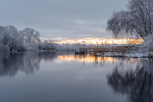 landscape with snowy trees, beautiful river, snowcovered