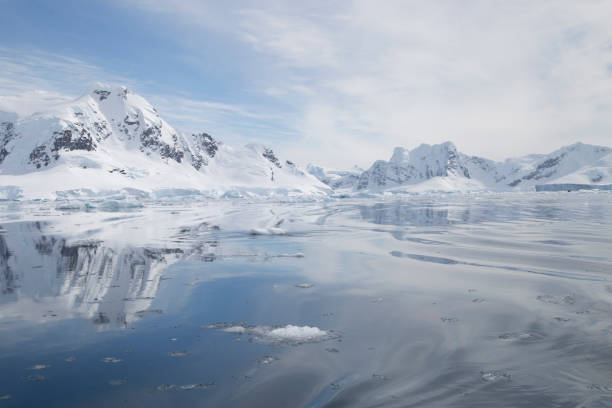 Hazy Mountain Landscape Hazy mountain landscape reflected in the water at Paradise Bay in Antarctica. paradise bay antarctica stock pictures, royalty-free photos & images