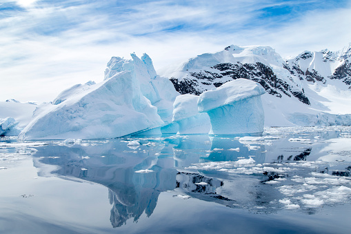 Iceberg reflecting off the water at Paradise Bay in Antarctica.