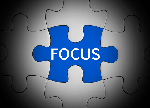 Focus concept on jigsaw puzzle.