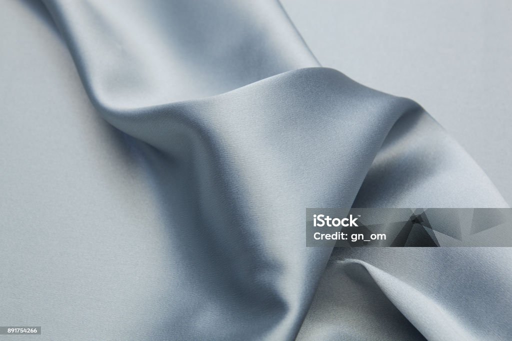 Wavy textile background Wavy satin fabric texture closeupWavy satin fabric texture closeup Satin Stock Photo