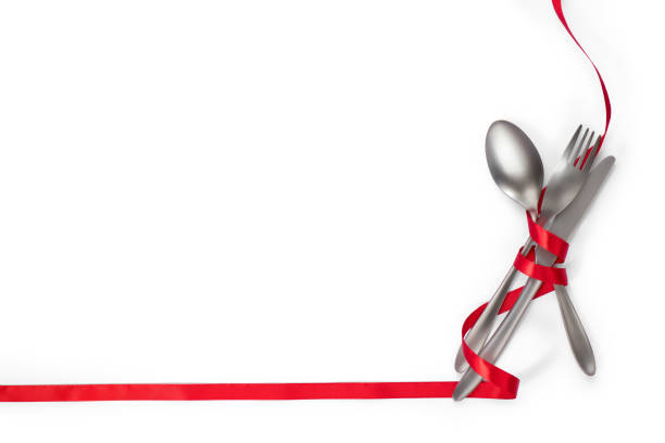 istock Cutlery with red ribbon as border isolated on white background with clipping path 891756336