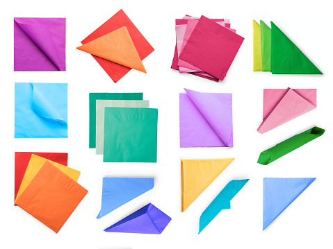 Various colored paper napkins collection. Isolated on white, clipping path included