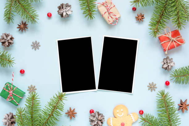 istock christmas blank photo cards in frame made of fir tree branches, decorations and gift boxes 891758492