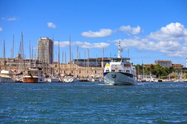 Selective focus on ferry boat at old port in Marseille, France with blue sky