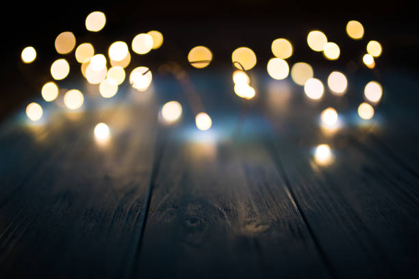 istock christmas gold light bokeh background with copy space 891763558