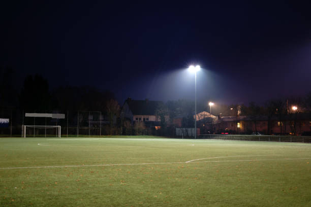istock Illuminated football field in the night 891766160