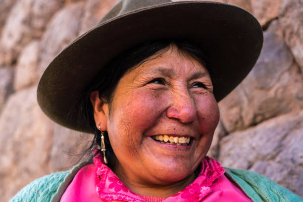 istock Peruvian woman at Inca ruins, The Sacred Valley, Cusco, Peru 891772116