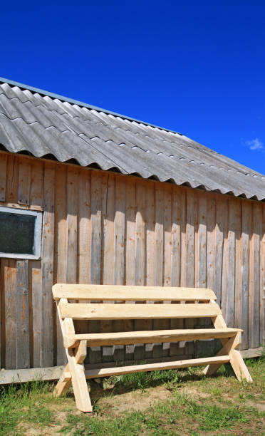 istock wooden bench near wooden wall 891772430