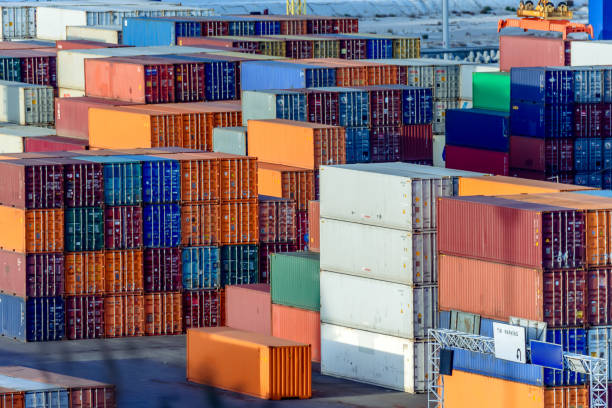istock Multicolored sea containers, laid flat with stacks for storage and transportation 891781118