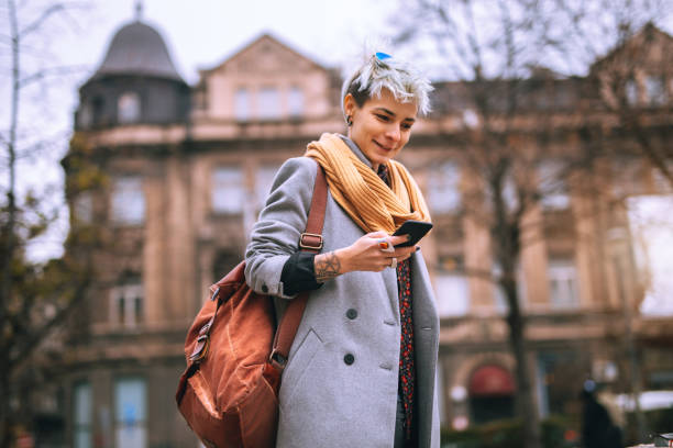 istock Woman using mobile in the city 891791844